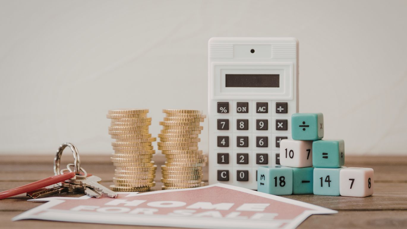 Professional celebrating success while working on a laptop