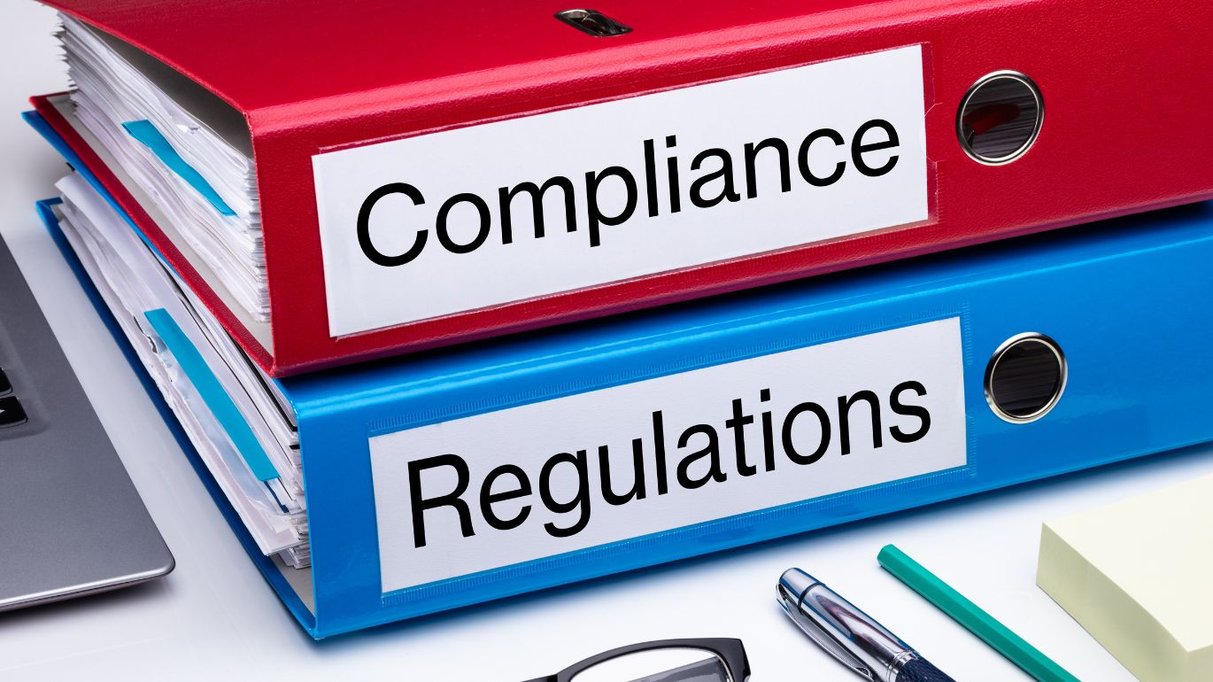 Professional celebrating success while working on a laptop